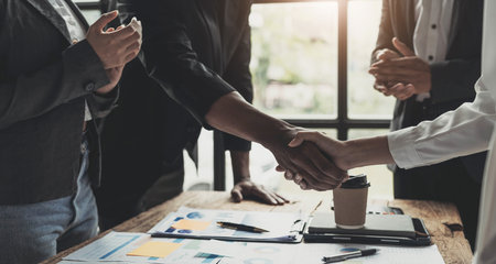 Business people shaking hands, finishing up meeting, business etiquette, congratulation, merger and...