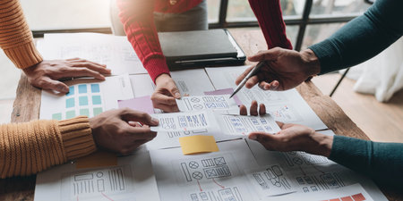 UI UX creative designer team designing wireframe layout for responsive mobile smartphone application in officeの写真素材