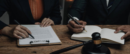 Close up lawyer businessman working or reading lawbook in office workplace for consultant lawyer...