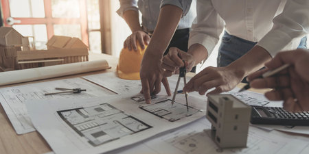 Engineer Teamwork Meeting, Drawing working on blueprint meeting for project working with partner on...