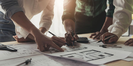 Engineer Teamwork Meeting, Drawing working on blueprint meeting for project working with partner on model building and engineering tools in working site, Construction and structure concept..の写真素材