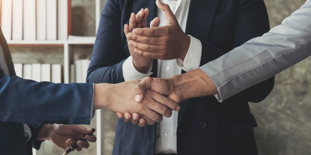 Business handshake for teamwork of business merger and acquisition,successful negotiate,hand shake,two businessman shake hand with partner to celebration partnership and business deal concept.の写真素材