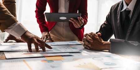 Business People Meeting using laptop computer,calculator,notebook,stock market chart paper for analysis Plans to improve quality next month. Conference Discussion Corporate Concept..の写真素材