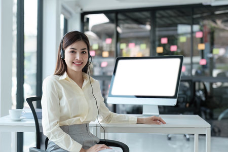 close up call center operator in wireless headset talking with customer, woman in headphones with...