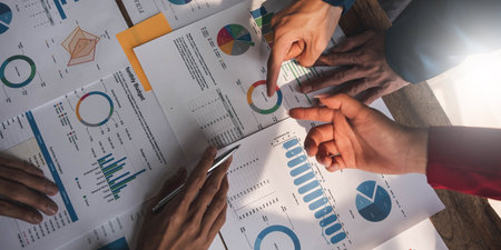 Business People Meeting using laptop computer,calculator,notebook,stock market chart paper for analysis Plans to improve quality next month. Conference Discussion Corporate Concept..の写真素材