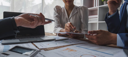 Business financial, accountant discussing with partner are meeting to audit finance planning sales to meet targets set in next year. stock market concept..の写真素材