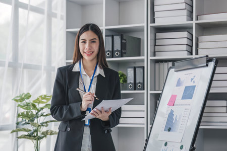 Business woman using calculator for do math finance on wooden desk in office and business working background, tax, accounting, statistics and analytic research concept..の写真素材