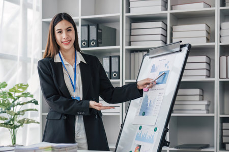 Business woman using calculator for do math finance on wooden desk in office and business working background, tax, accounting, statistics and analytic research concept..の写真素材