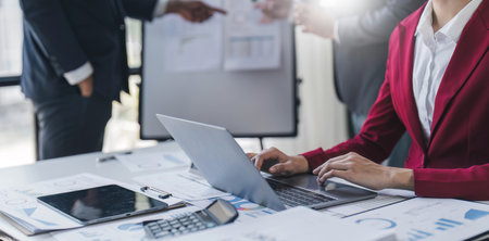 Asian business adviser meeting to analyze and discuss the situation on the financial report in the meeting room.Investment Consultant, Financial advisor and accounting concept.の写真素材