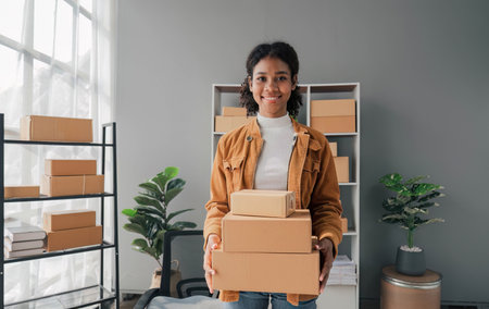 Startup small business entrepreneur SME, asian woman packing cloth in box. Portrait young Asian...