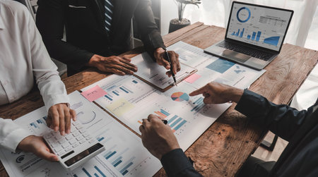Business People Meeting using laptop computer,calculator,notebook,stock market chart paper for analysis Plans to improve quality next month. Conference Discussion Corporate Concept..の写真素材