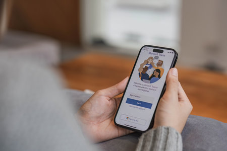 CHIANG MAI, THAILAND - APR 17, 2022 : A working from home employee is downloading the Microsoft Teams social platform, ready for remote working in isolation from homeのeditorial素材