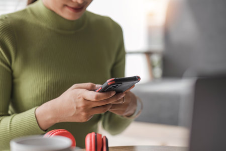 Close up woman using smart phone with hand finger touch screen, texting, chatting or social media