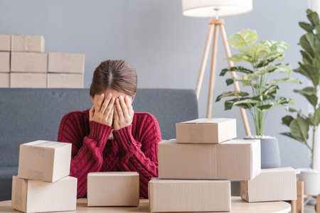 Small Business, Startup SME, Owner Entrepreneurs. Asian woman with unsuccess business online shopping crying and serious face unhappy mood.の写真素材
