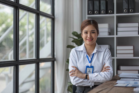 Young beautiful woman using her laptop while sitting in a chair at her working place, Small business owner people employee freelance online sme marketing e-commerce telemarketing concept.の写真素材