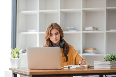 Asian women are bored from their online studies, have a sad face and have been tired from their...