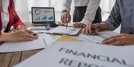 Business People Meeting using laptop computer,calculator,notebook,stock market chart paper for analysis Plans to improve quality next month. Conference Discussion Corporate Concept..の写真素材