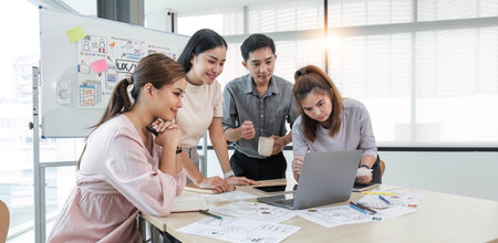 Asian office team brainstorming, plan for solution idea, Group of asia creative teamwork and woman leader at business meeting for developing mobile phone app, ux, ui start up, small businessの写真素材