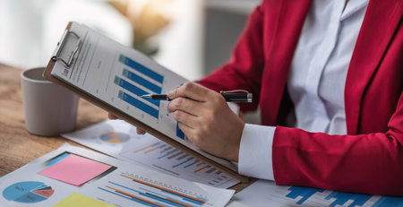 Close up of Business woman investment consultant analysis company annual financial report balance...