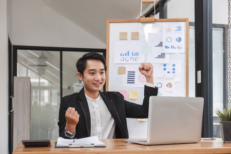 Businessman is happy that his business is successful.の写真素材