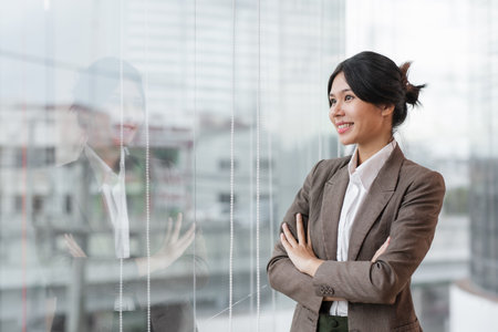 Portrait of a successful businesswoman standing with her arms crossed with confidence.の写真素材
