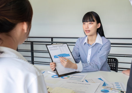 business consultant Plan investment and market analysis with colleagues in the office.の写真素材