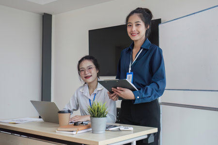team business people talk project strategy at office meeting room. Businesswoman discuss project planning with colleague at modern workplace while having conversation and advice on financial reportの写真素材