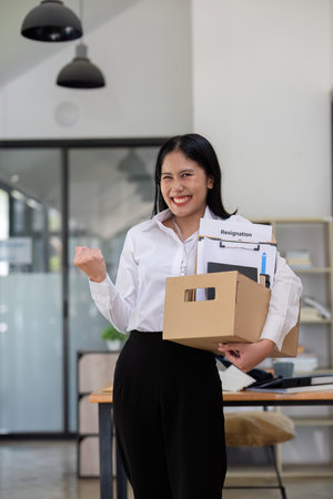 Excited woman feeling cheerful celebrating online winning result Inspired by great offers Or a new opportunity, pass the exam, get a job.の写真素材