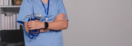 Close up a doctor standing with his arms crossed holding a stethoscope, a doctor from the hospital....