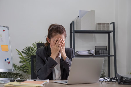 Puzzled confused asian woman thinking hard concerned about online problem solution looking at laptop...