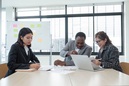 Business People Meeting using laptop computer,calculator,notebook,stock market chart paper for analysis Plans to improve quality next month. Conference Discussion Corporate Conceptの写真素材