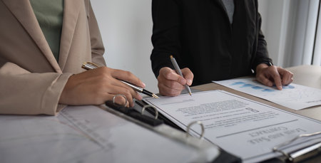 Close-up of the agreement document being signed. Business contract of young businesswomanの写真素材