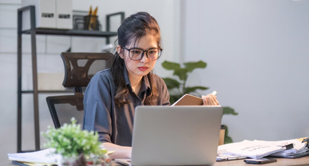 Puzzled confused asian woman thinking hard concerned about online problem solution looking at laptop...