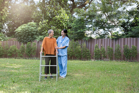 Caregiver Assisting Elderly Woman Outdoors for Health and Wellness, Senior Care, and Supportive...