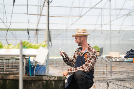 Gardener Tending to Vegetables in a Modern Greenhouse Setting with Advanced Agricultural Techniques