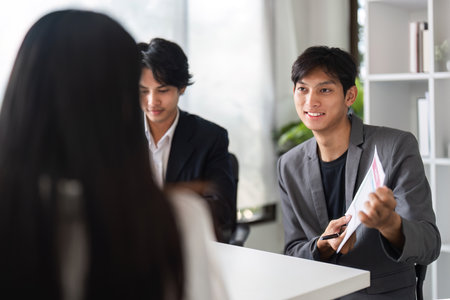 Business Team Meeting for Idea Exchange and Collaboration in Modern Office Settingの写真素材