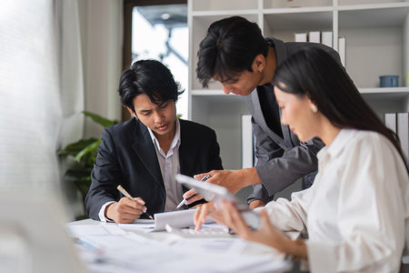 Business Team Collaborating in Modern Conference Room for Strategic Planning and Idea Exchangeの写真素材