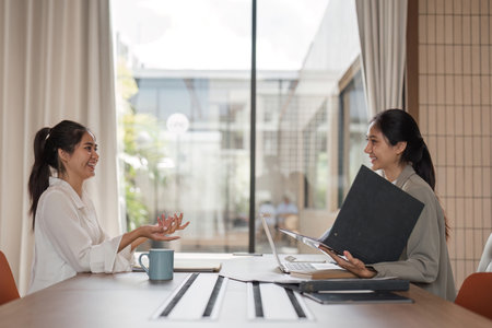 Business Team Engaged in a Productive Discussion and Consultation in a Modern Office Settingの写真素材