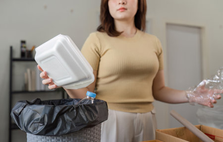 Eco-Conscious Woman Collecting Plastic Waste for Recycling and Environmental Conservation Efforts