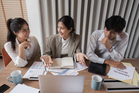 Businessman Leading a Productive Meeting with Employees, Offering Strategic Advice and Insights for Business Growth and Successの写真素材