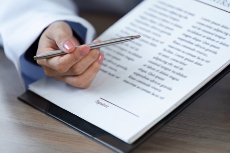Doctor Advises Patient to Sign Important Medical Documents for Health and Treatment Authorization in...