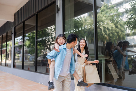Joyful Family Shopping Experience with Parents and Children Enjoying a Day Out in the Cityの写真素材