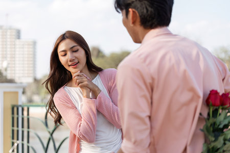 Romantic valentines surprise for lovers urban rooftop lifestyle photo bright day close-up love storyの写真素材