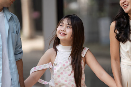 Joyful Family Shopping Experience Smiling Parents and Child Enjoying a Day Out in the Cityの写真素材