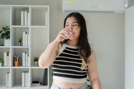 Confident Young Woman Enjoying Healthy Meal at Home for a Balanced Lifestyle and Wellbeing
