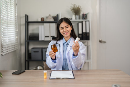 Doctor Recommending Medication for Online Medical Treatment in a Modern Office Settingの写真素材