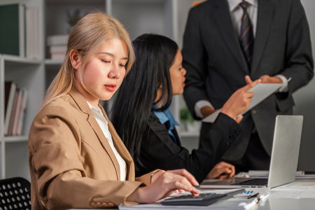 Business Team Collaborating on Strategic Work Plans in a Modern Office Environmentの写真素材