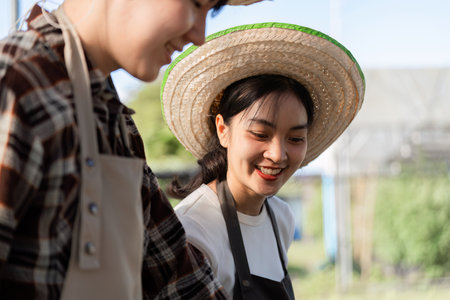 Cheerful Female Farmer Smiling in Sunlit Field Wearing Straw Hat and Apron, Embracing Sustainable...