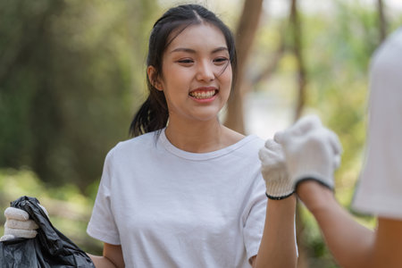 Smiling volunteer enjoying a successful cleanup effort in nature