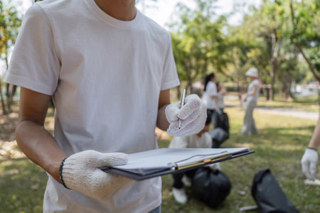 Volunteer documenting progress during a community cleanup initiative.